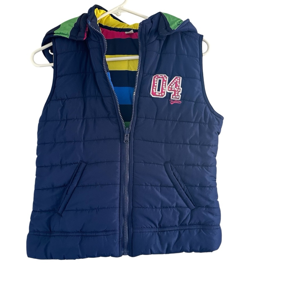 Justice reversible Navy Puffer Vest with Colorful‎ stripes on reverse.